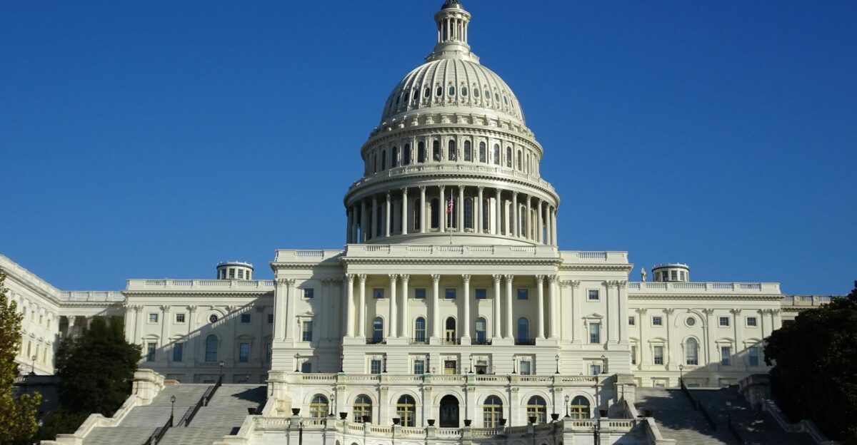 Stunning facade of the iconic United States Capitol in Washington D C against a clear blue sky