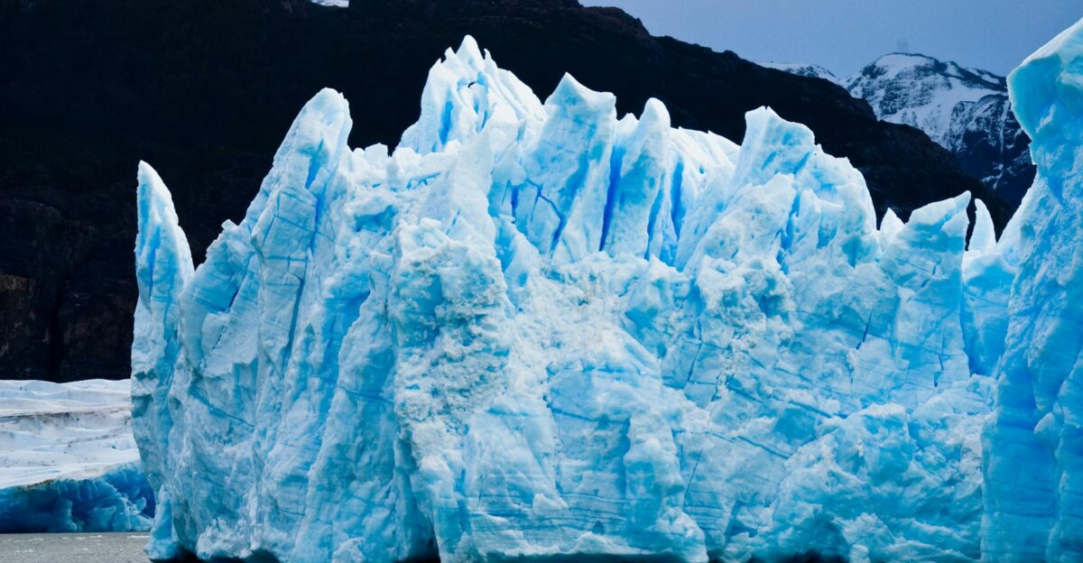 A stunning view of a towering blue glacier in the Antarctic region showcasing natural beauty