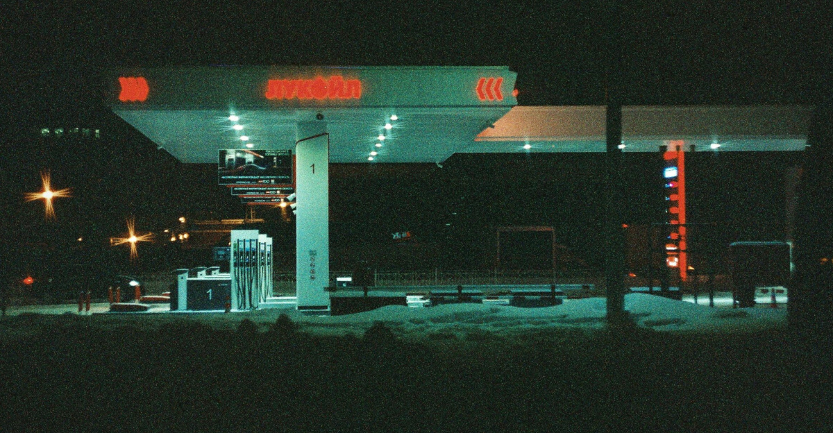 Atmospheric night view of an illuminated gas station in Saint Petersburg, Russia.