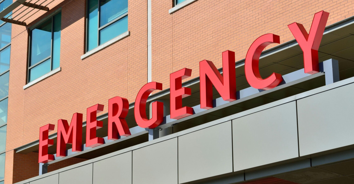 Close-up of a modern hospital emergency room entrance with prominent red letters.