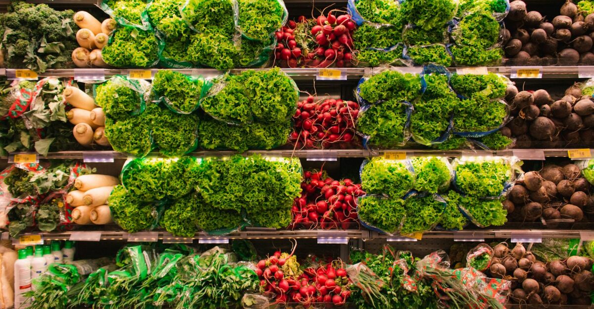 Colorful assortment of fresh vegetables arranged on supermarket shelves perfect for healthy eating themes
