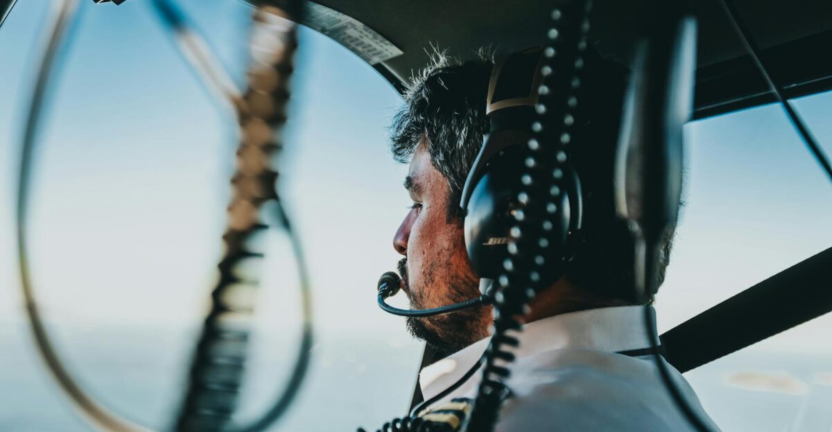 Pilot navigating helicopter over Rio de Janeiro Brazil with scenic aerial views