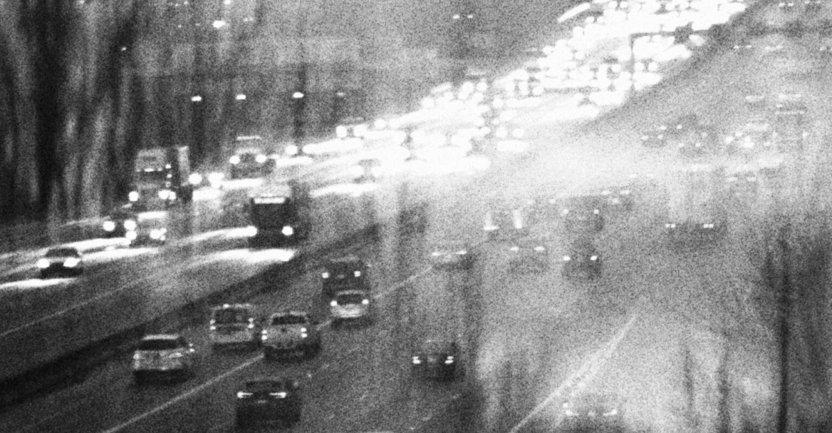 Moody black and white image of busy highway traffic in SeaTac, Washington.