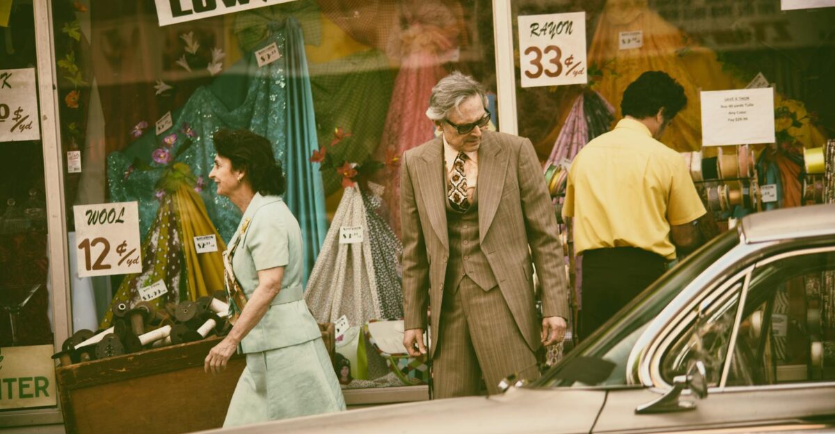 Retro-styled shoppers pass a vintage store in a classic city setting Nostalgic vibe