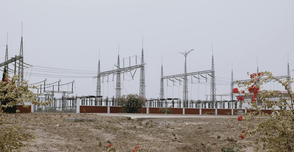 Outdoor view of an electrical substation in a dry landscape with power lines