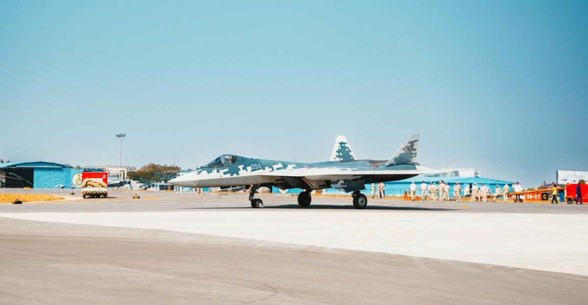 A Sukhoi Su-57 fighter jet stationed on a military airfield runway