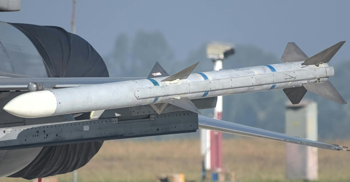 Close-up of a missile mounted on a military aircraft wing at an airshow in Bengaluru, India.
