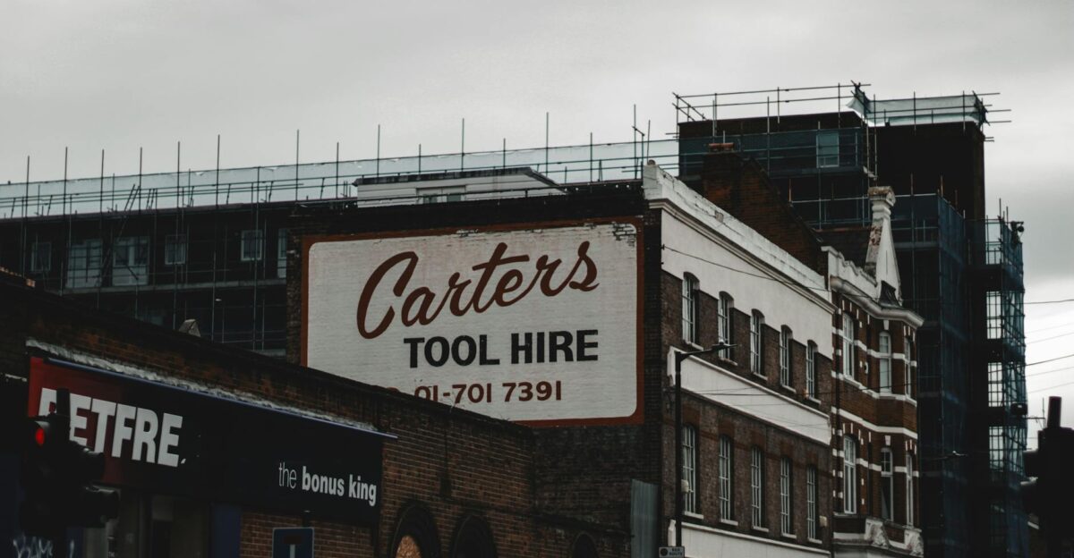 An atmospheric view of Carter s Tool Hire billboard on Old Kent Road London under cloudy skies