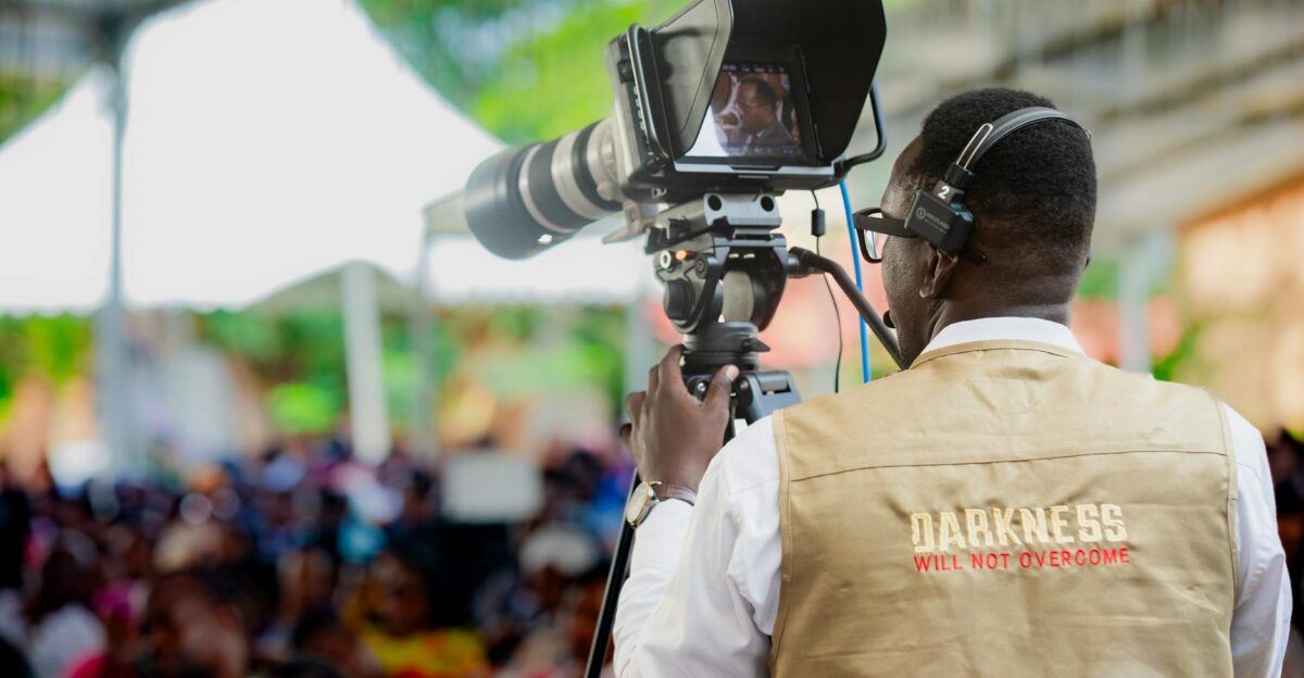 Cameraman filming an outdoor event in Dar es Salaam Tanzania
