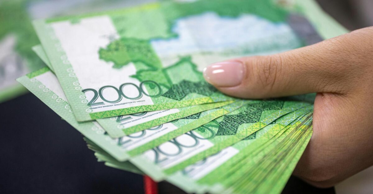 Close-up of a hand holding 2000 Russian Ruble banknotes financial concept