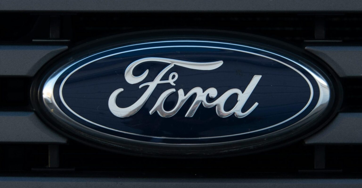 Detailed view of a Ford emblem mounted on a vehicle grille, showcasing modern design.