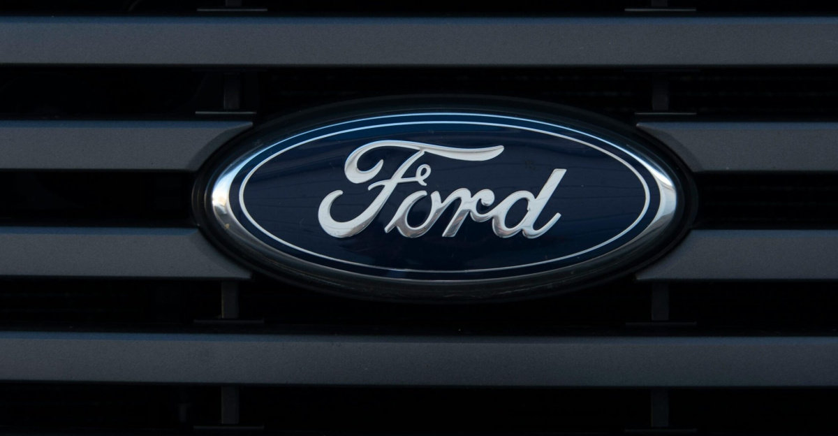 Detailed view of a Ford emblem mounted on a vehicle grille, showcasing modern design.