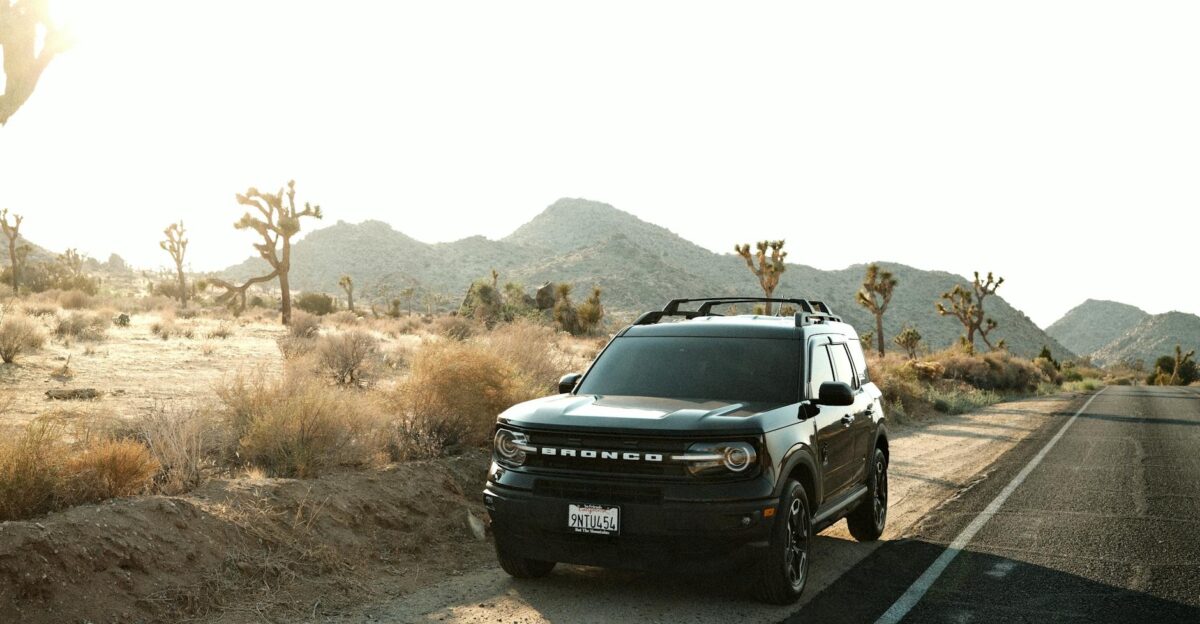 Explore the scenic beauty of Joshua Tree desert with this Ford on a sunny road trip