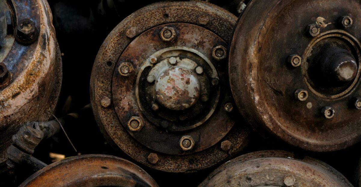 Closeup of rusty abandoned car parts showcasing decay and vintage industrial elements
