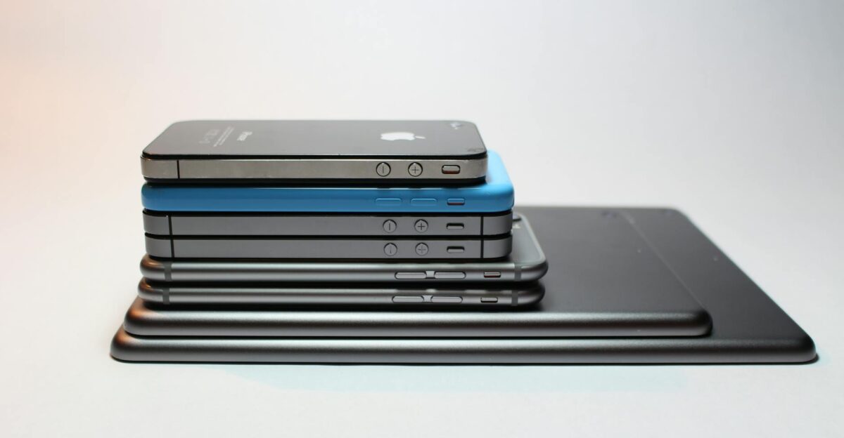 Stacked modern smartphones and tablets showcasing sleek design Perfect tech background