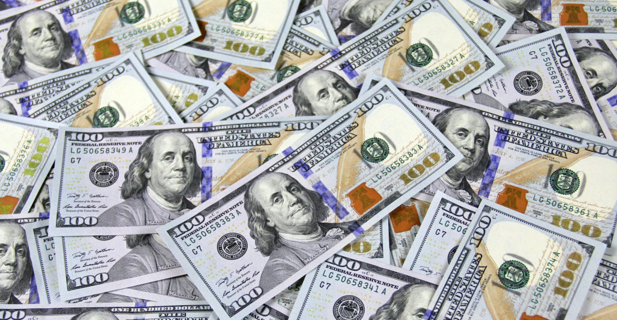 Pile of US hundred dollar bills depicting financial success and wealth.