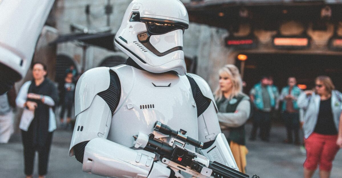 Stormtrooper character in costume at a busy sci-fi themed park event