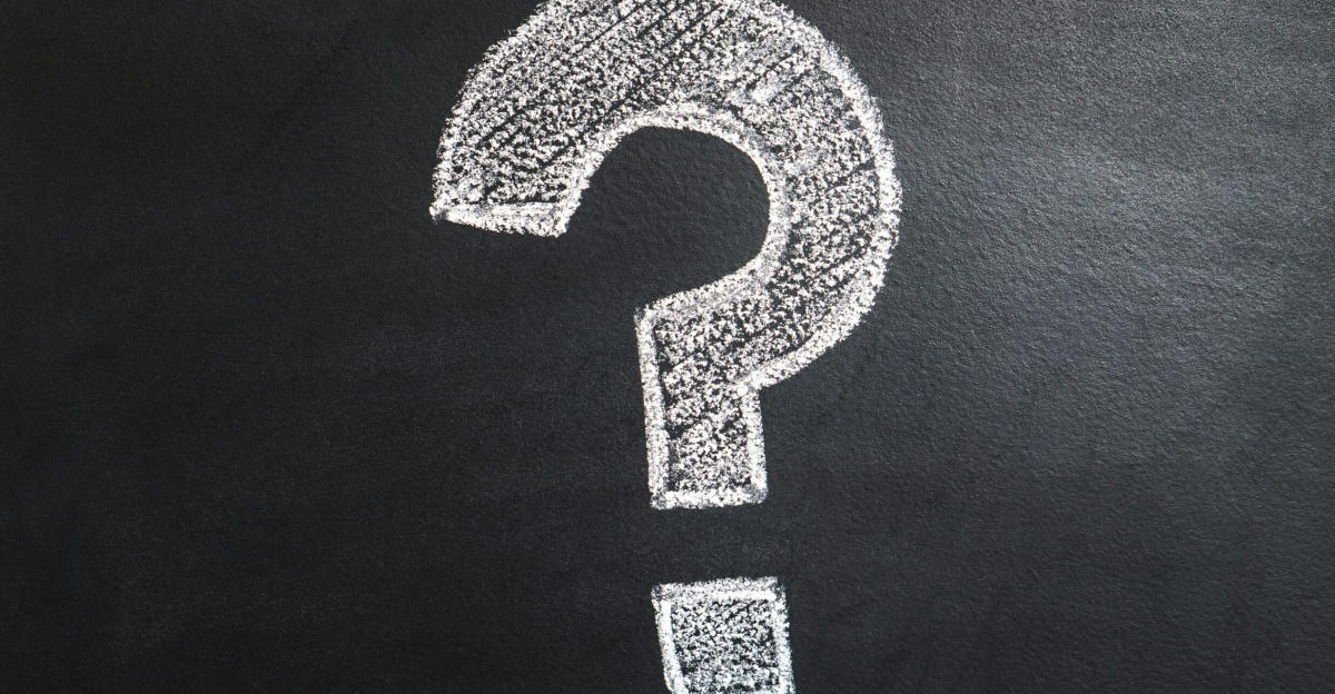 A conceptual image featuring a question mark drawn on a chalkboard, ideal for problem-solving contexts.