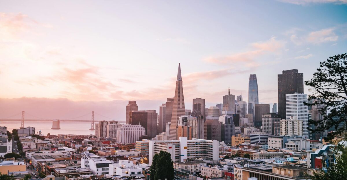 Stunning view of San Francisco cityscape with iconic landmarks during sunrise