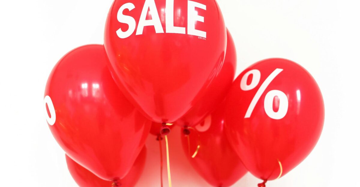 Bright red balloons with SALE and symbols perfect for marketing promotions