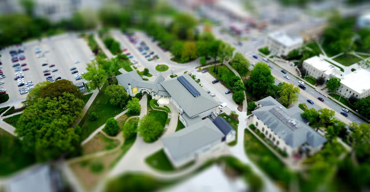 Aerial view of campus with green landscaping and parking Manhattan KS