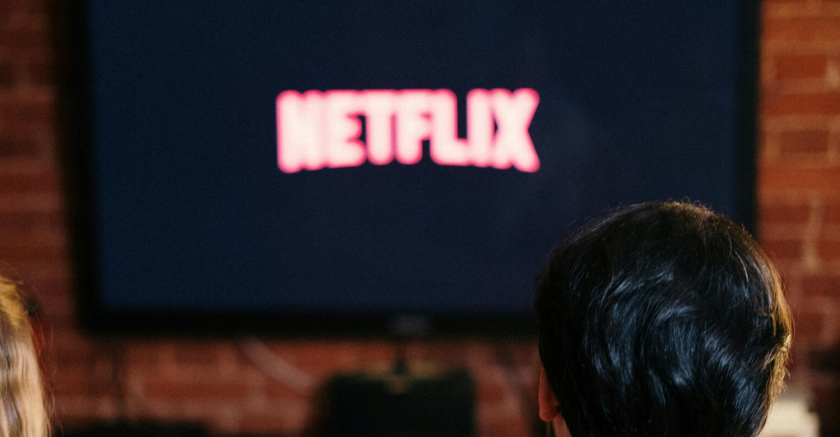 A couple enjoys a relaxed evening watching Netflix in their living room.
