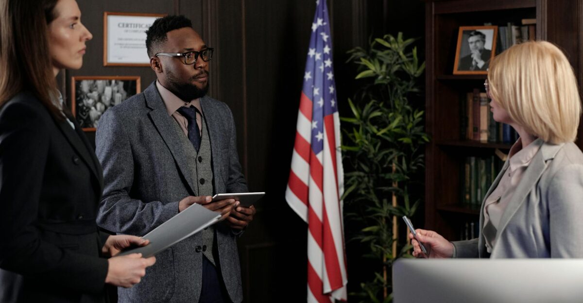 Business professionals in formal discussion advocating teamwork and diversity