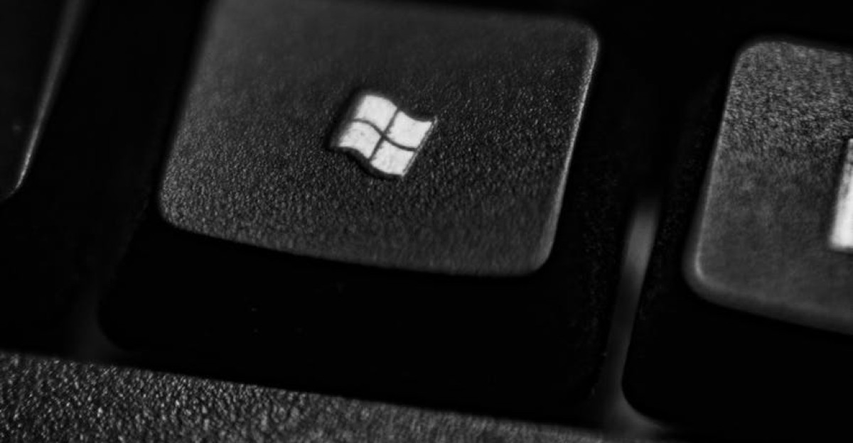 High-quality close-up of a Windows logo key on a black plastic keyboard