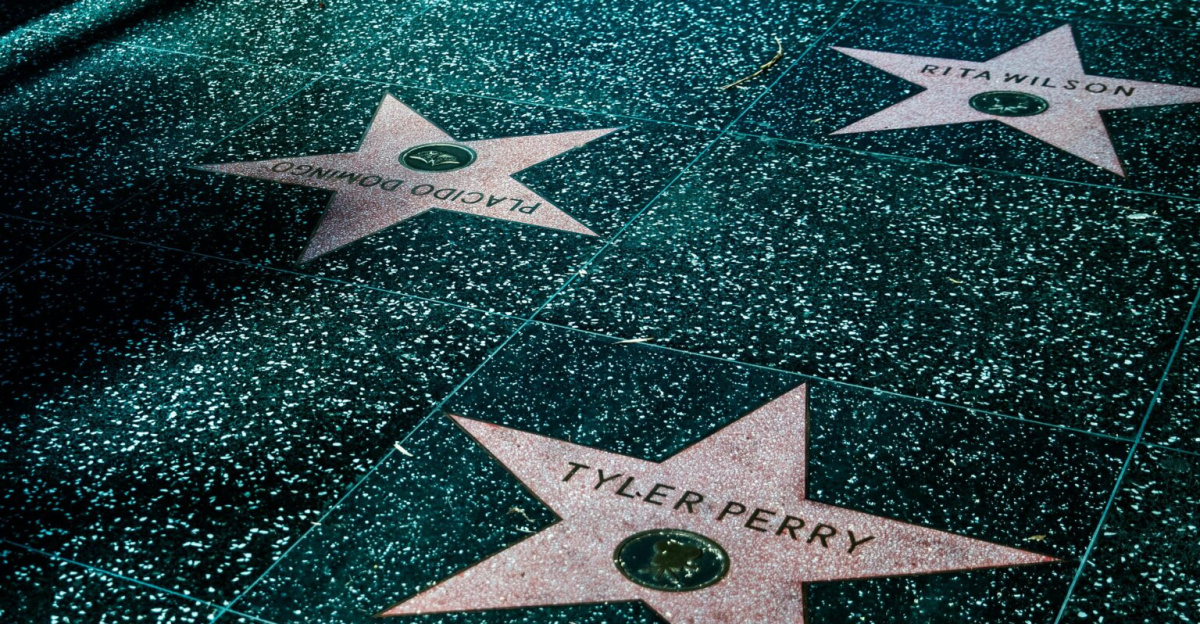 Night view of Hollywood Walk of Fame stars showcasing celebrity names and iconic design.