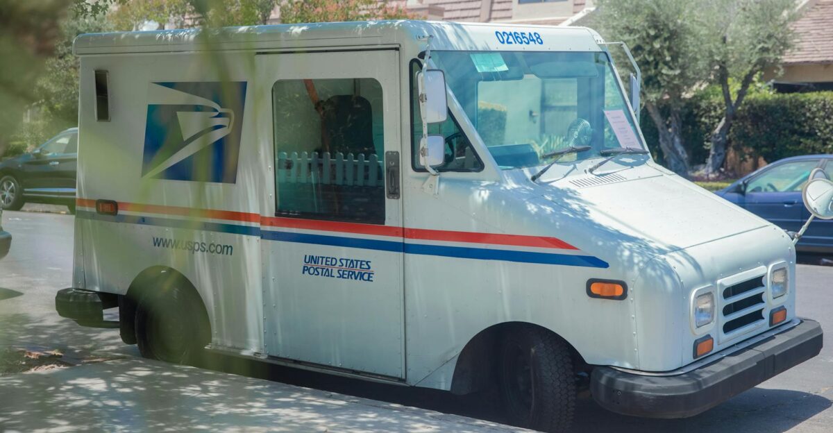 United States Postal Service van parked on a sunny street in Los Angeles CA