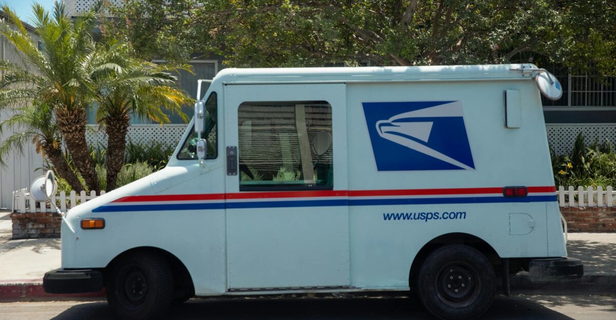 United States Postal Service van parked in a residential area on a bright sunny day