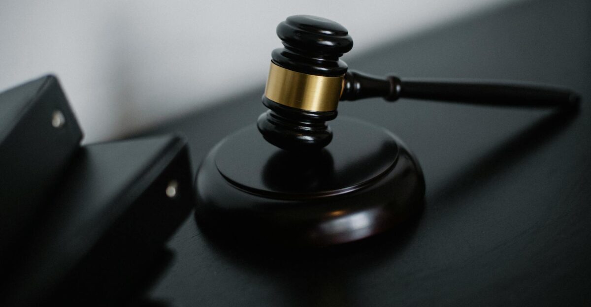 Close-up of a wooden gavel on a desk symbolizing justice and legal authority