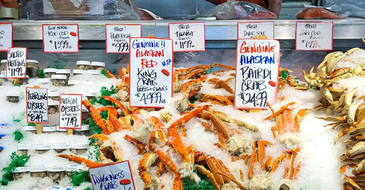 Fresh seafood display with crabs and oysters at a market in Seattle.