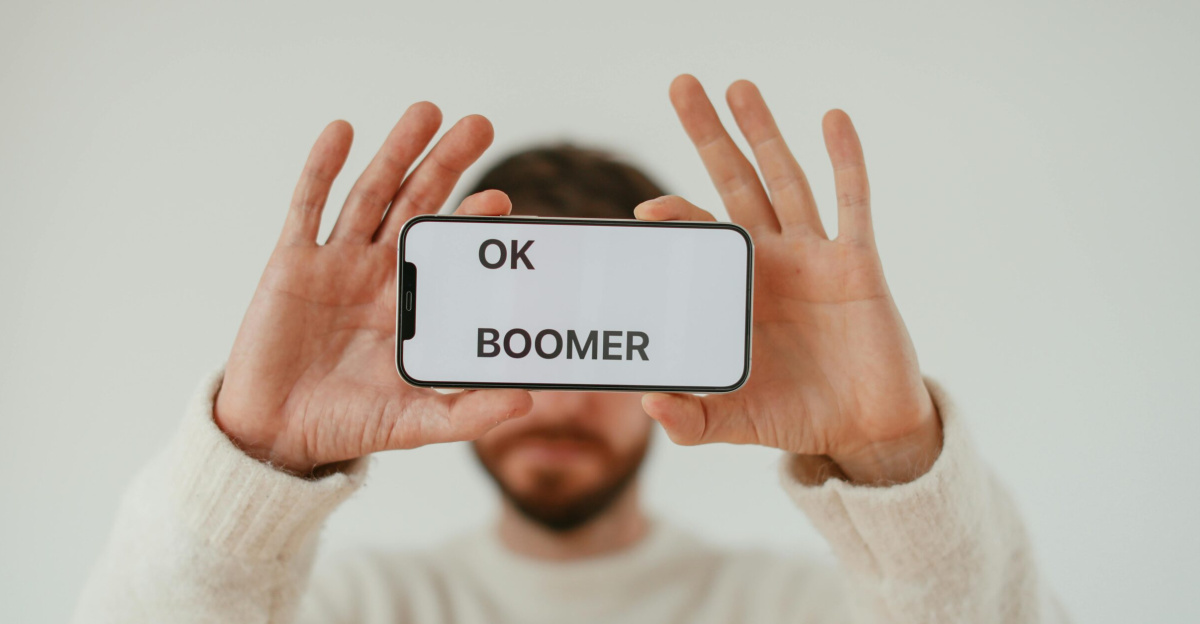 A man holding a smartphone with 'OK Boomer' text, emphasizing generational themes and internet culture.