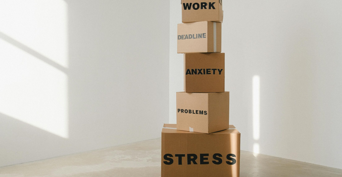 Cardboard boxes stacked in an empty room, symbolizing stress and anxiety with labeled problems.