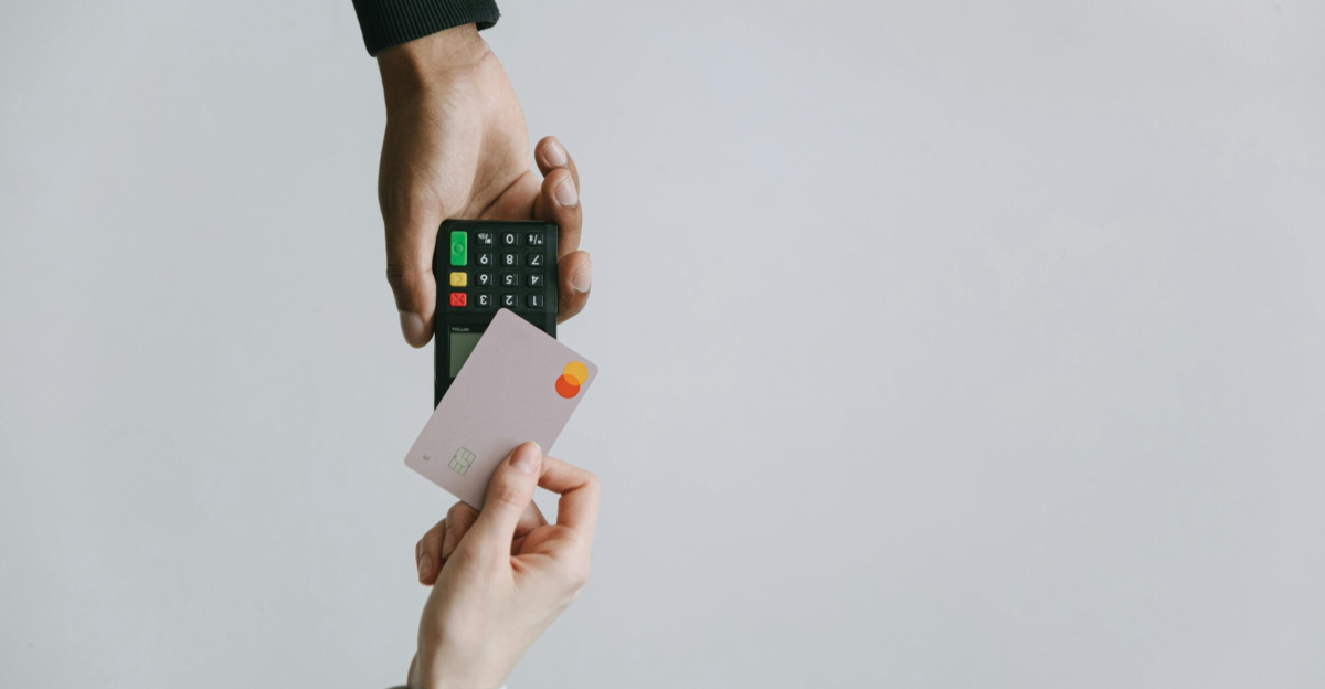 Modern contactless payment using a card and terminal, highlighting the ease of digital transactions.