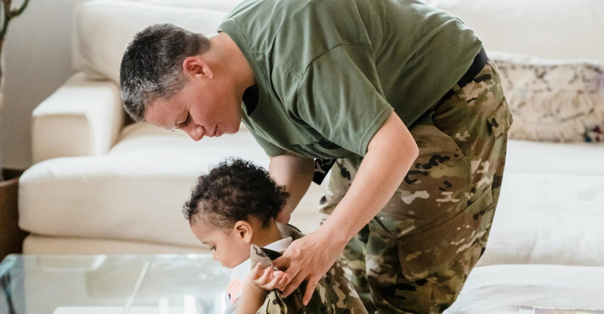 Father helps young son try on a military uniform in the living room, sharing a playful family moment.