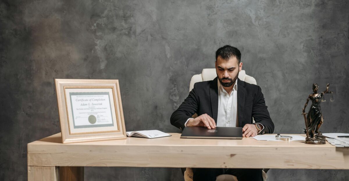 A bearded lawyer working at his office desk showing professionalism and expertise