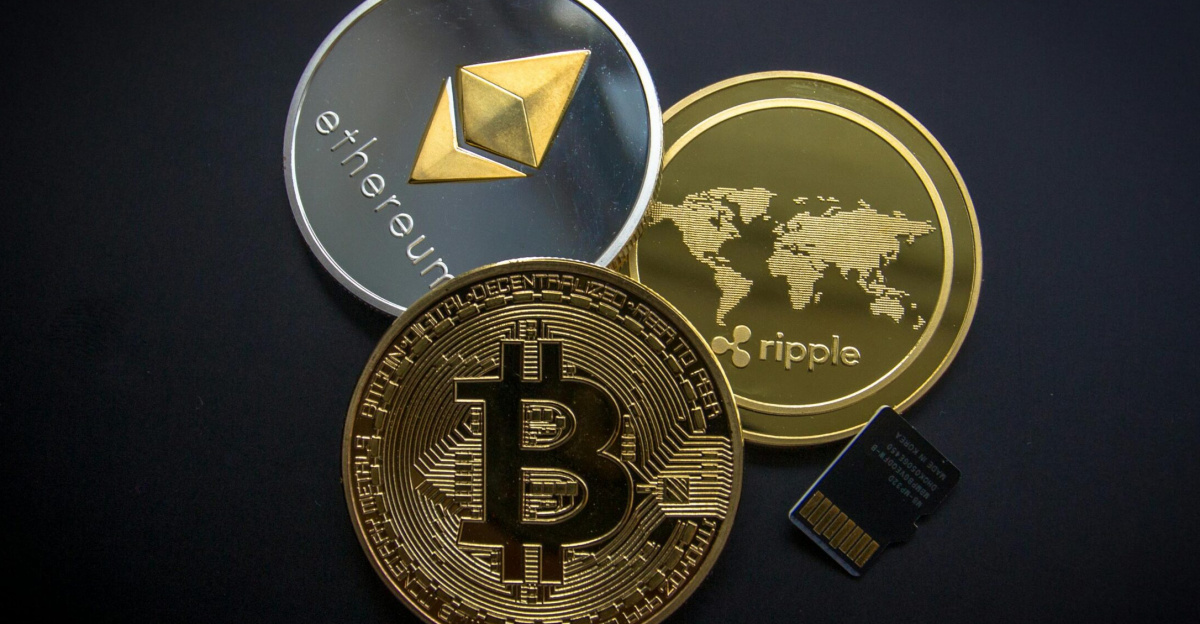 A striking image of Bitcoin, Ethereum, and Ripple coins illustrating modern digital currency.