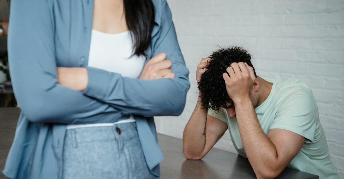 A couple experiencing relationship stress and conflict in an indoor setting illustrating discord and tension