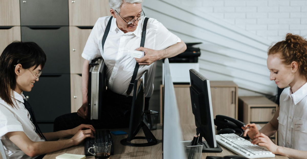 Group of diverse office workers collaborating at their desks. Professional teamwork setting.