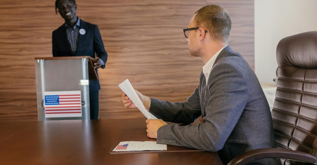 Two professionals in discussion during a political meeting in a modern conference room