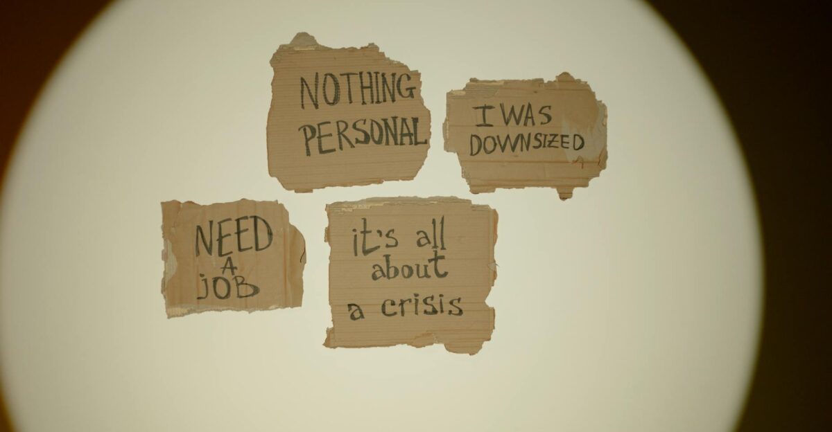 Cardboard signs convey job loss and economic crisis message ideal for articles on unemployment