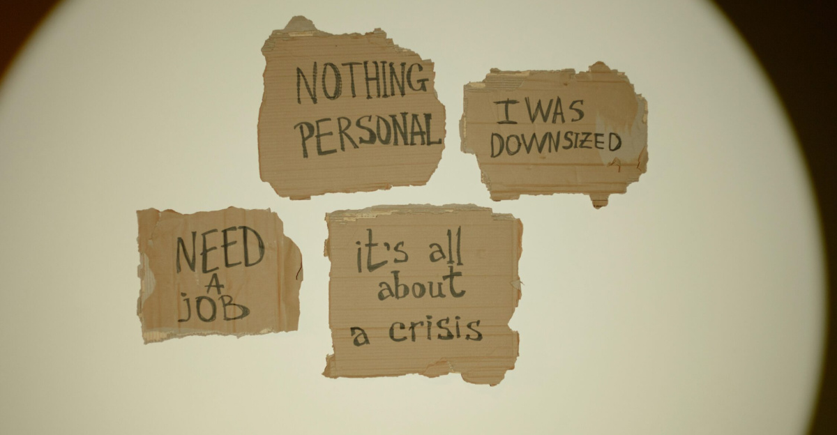 Cardboard signs convey job loss and economic crisis message, ideal for articles on unemployment.