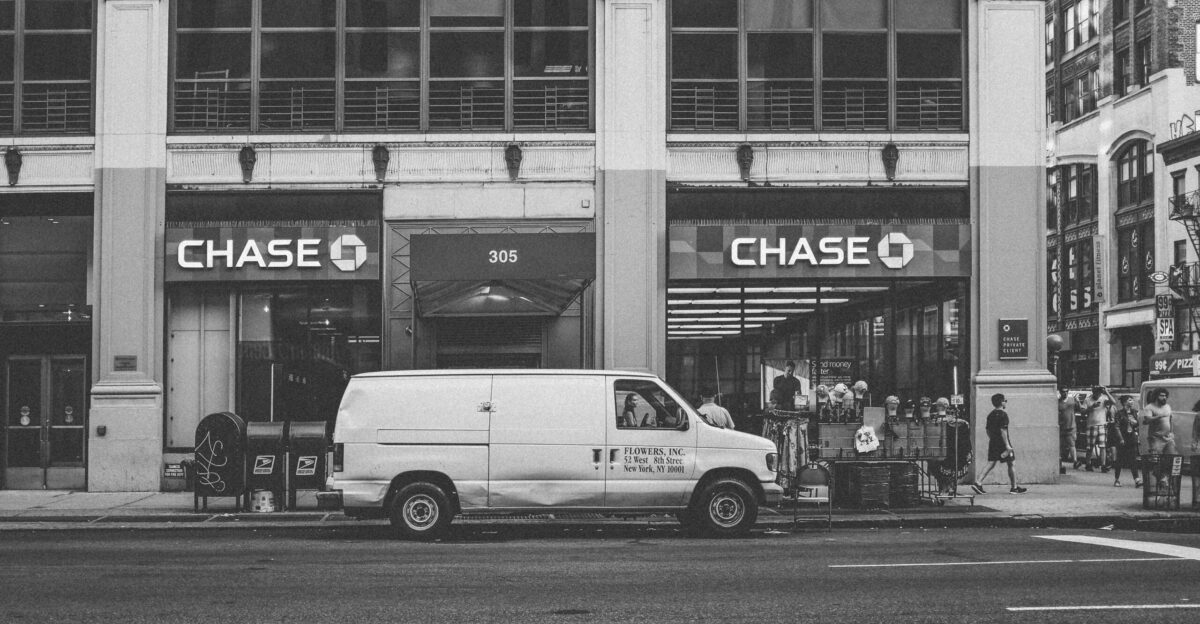 white van parked beside building