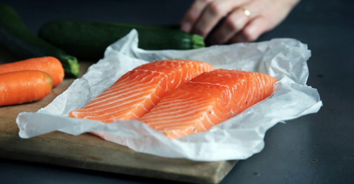 raw fish meat on brown chopping board