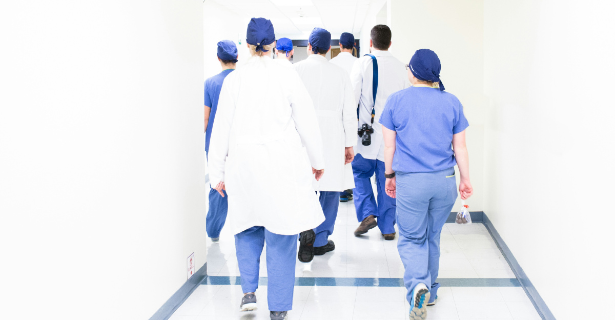 group of doctors walking on hospital hallway