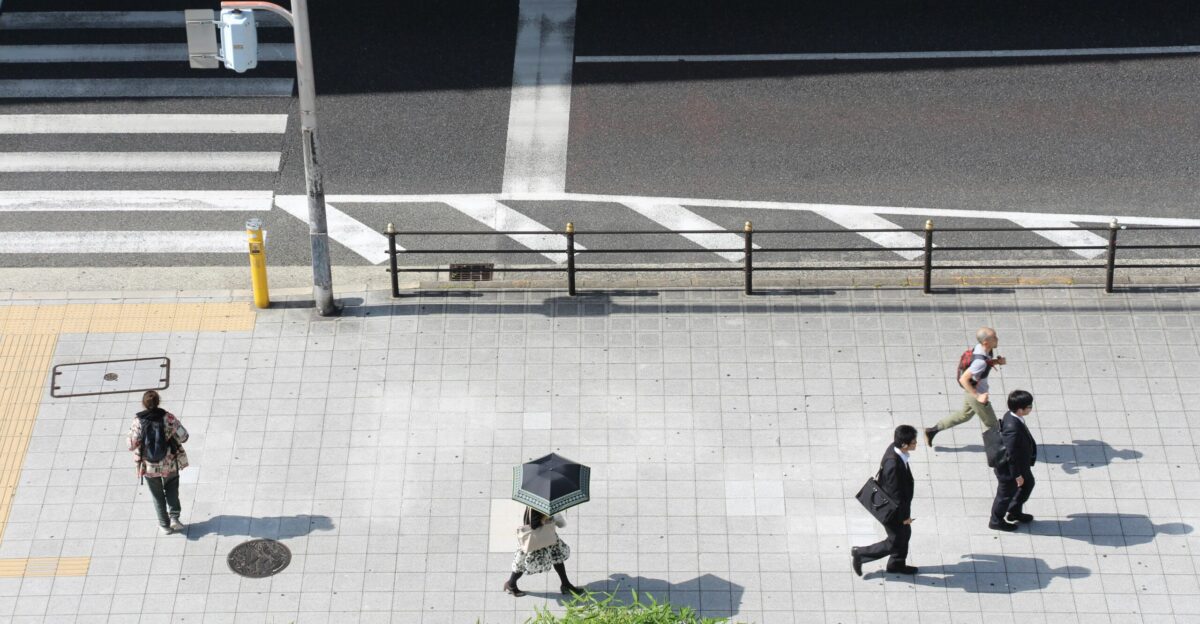 group of people walking on street walk