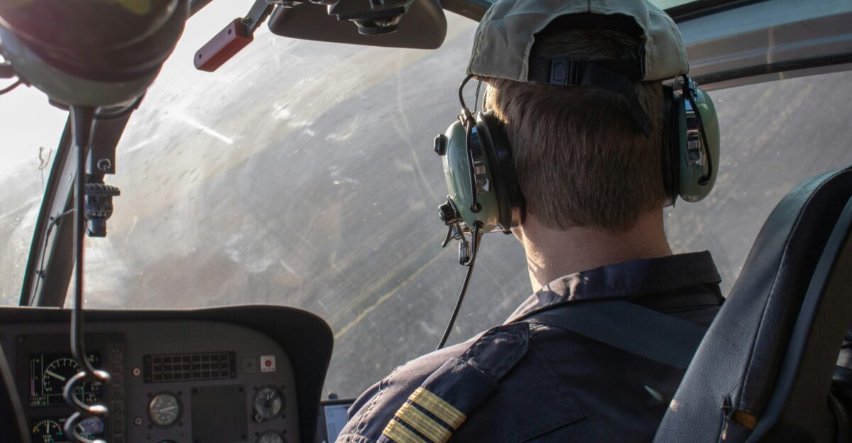 man driving helicopter