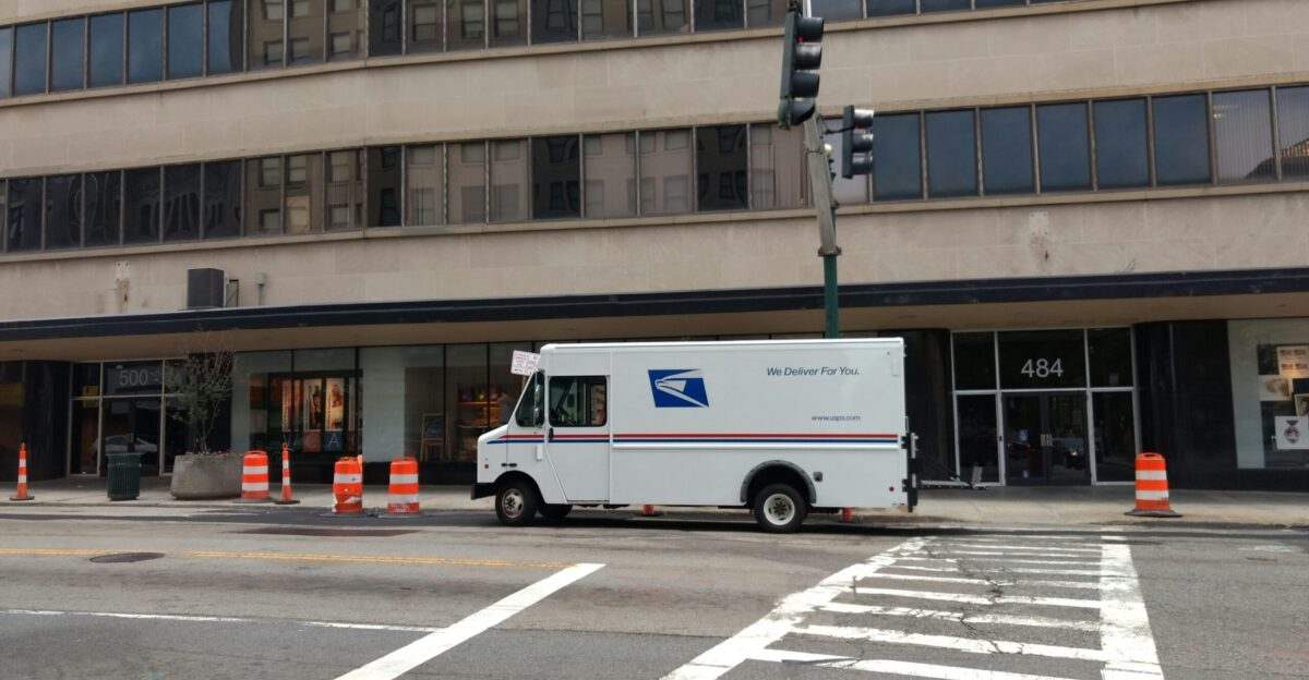 white van near concrete building